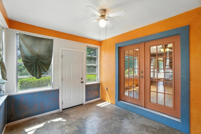 899 Meadowview Dr, Columbus, OH 43224 - entryway featuring a ceiling fan, french doors, and unfinished concrete flooring