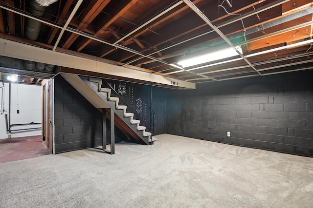 899 Meadowview Dr, Columbus, OH 43224 - below grade area featuring stairs, carpet floors, and concrete block wall