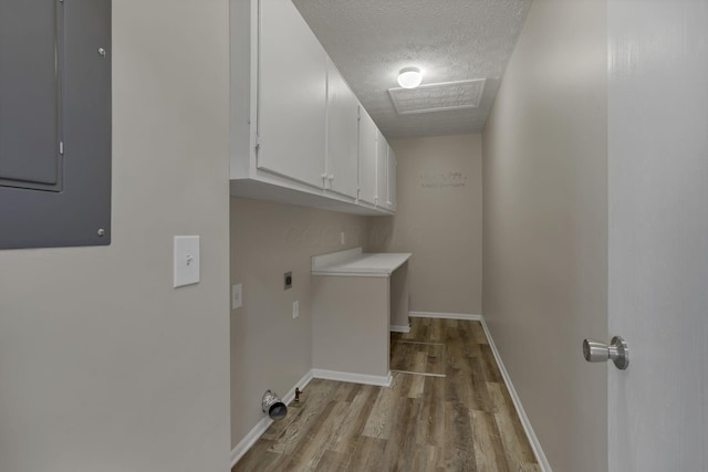 6658 Lagrange Dr Unit 43E, Canal Winchester, OH 43110 - laundry area featuring cabinet space, hookup for an electric dryer, light wood finished floors, a textured ceiling, and electric panel