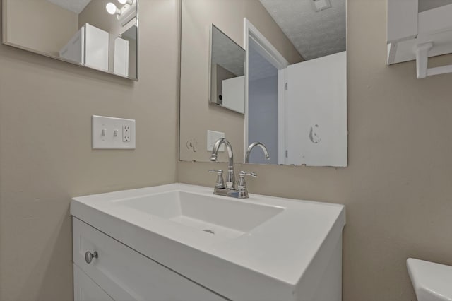 6658 Lagrange Dr Unit 43E, Canal Winchester, OH 43110 - bathroom with vanity and a textured ceiling