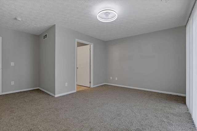 6658 Lagrange Dr Unit 43E, Canal Winchester, OH 43110 - empty room with light colored carpet, a smoke detector, and a textured ceiling