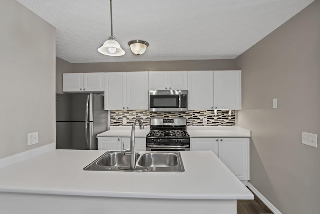 6658 Lagrange Dr Unit 43E, Canal Winchester, OH 43110 - kitchen with stainless steel appliances, backsplash, and white cabinetry