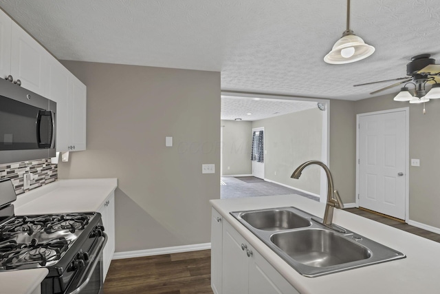 6658 Lagrange Dr Unit 43E, Canal Winchester, OH 43110 - kitchen with appliances with stainless steel finishes, a textured ceiling, white cabinets, a ceiling fan, and dark wood-style floors