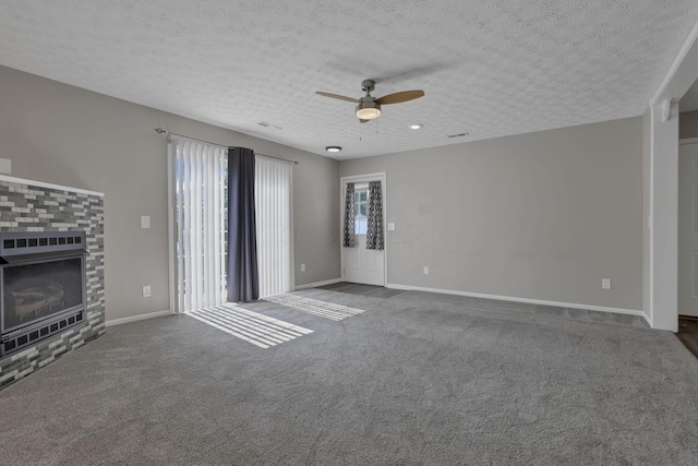 6658 Lagrange Dr Unit 43E, Canal Winchester, OH 43110 - unfurnished living room featuring a ceiling fan, a fireplace, carpet flooring, and a textured ceiling