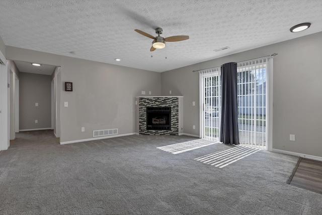6658 Lagrange Dr Unit 43E, Canal Winchester, OH 43110 - unfurnished living room with a ceiling fan, carpet flooring, a fireplace, and a textured ceiling