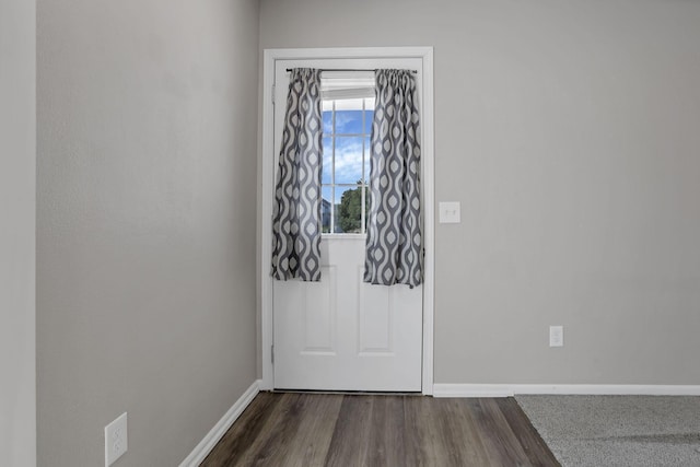 6658 Lagrange Dr Unit 43E, Canal Winchester, OH 43110 - doorway to outside featuring baseboards and dark wood-style floors