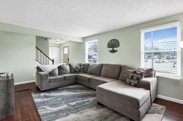 664 Dukewell Pl, Galloway, OH 43119 - living room with a textured ceiling, wood finished floors, and stairway