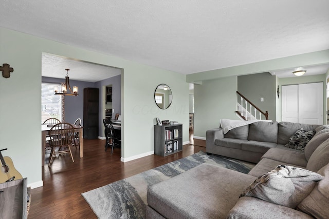 664 Dukewell Pl, Galloway, OH 43119 - living room with a chandelier, dark wood-style floors, and stairs