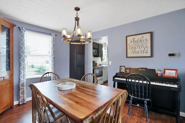 664 Dukewell Pl, Galloway, OH 43119 - dining room featuring a chandelier and dark wood finished floors