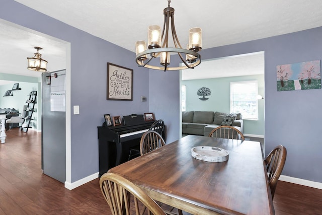 664 Dukewell Pl, Galloway, OH 43119 - dining area featuring a chandelier and dark wood finished floors