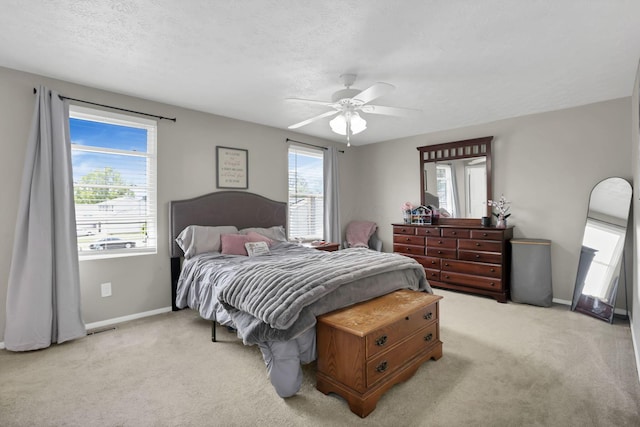664 Dukewell Pl, Galloway, OH 43119 - bedroom featuring light carpet, ceiling fan, and a textured ceiling