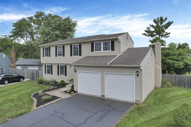 664 Dukewell Pl, Galloway, OH 43119 - view of front facade featuring driveway and a chimney