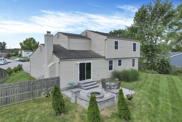664 Dukewell Pl, Galloway, OH 43119 - back of property featuring a patio, entry steps, a chimney, and a shingled roof