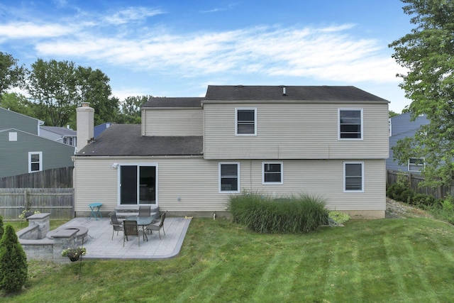 664 Dukewell Pl, Galloway, OH 43119 - rear view of house with a patio and a chimney
