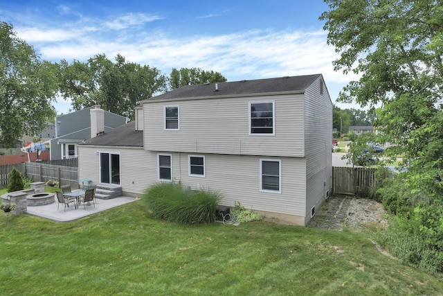 664 Dukewell Pl, Galloway, OH 43119 - back of house with a patio, a fenced backyard, a fire pit, and a chimney