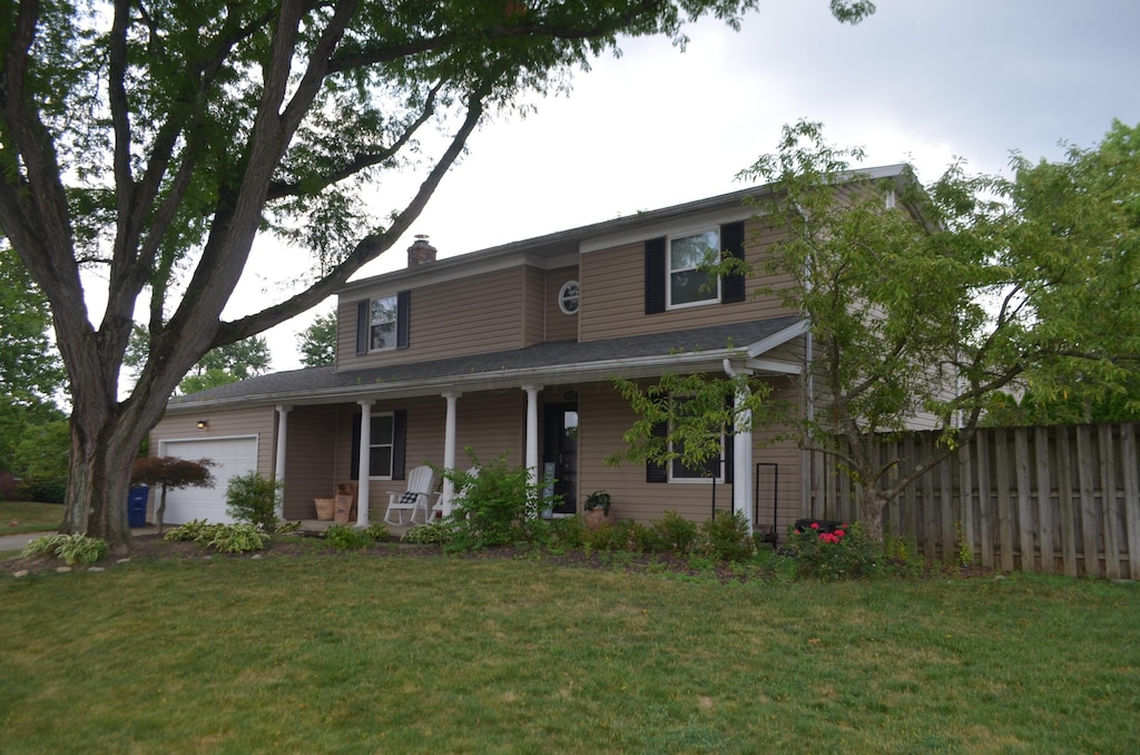 3421 Noreen Dr, Columbus, OH 43221 - view of front of property with a porch, an attached garage, and a chimney
