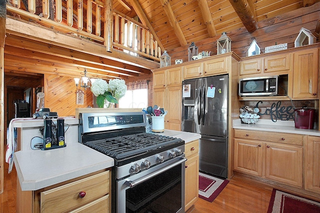 8713 State Route 207, Mount Sterling, OH 43143 - kitchen with appliances with stainless steel finishes, wooden ceiling, wooden walls, light wood finished floors, and light countertops