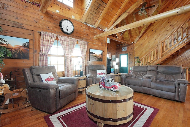 8713 State Route 207, Mount Sterling, OH 43143 - living room with wood walls, high vaulted ceiling, a wood ceiling with exposed beams, and hardwood / wood-style floors