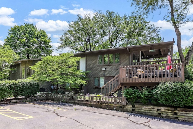 2109 W 5th Ave Unit C, Grandview Heights, OH 43212 - view of front facade featuring uncovered parking, a deck, and stairs