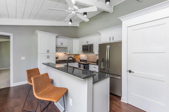 2109 W 5th Ave Unit C, Grandview Heights, OH 43212 - kitchen with appliances with stainless steel finishes, dark wood-style flooring, and white cabinetry