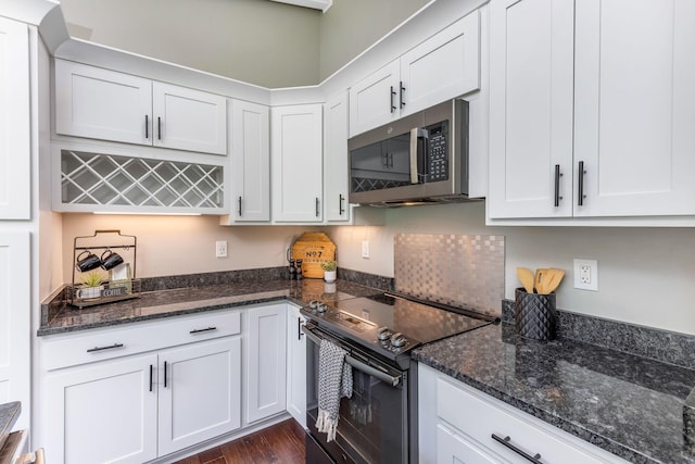 2109 W 5th Ave Unit C, Grandview Heights, OH 43212 - kitchen with black electric range oven, stainless steel microwave, white cabinetry, and dark wood-style floors