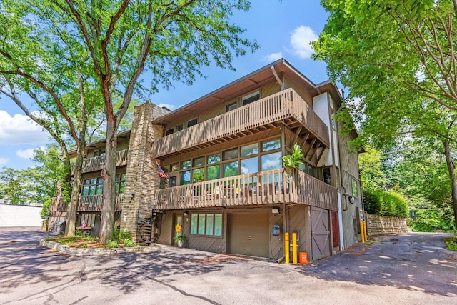 2109 W 5th Ave Unit C, Grandview Heights, OH 43212 - view of building exterior with a garage and asphalt driveway