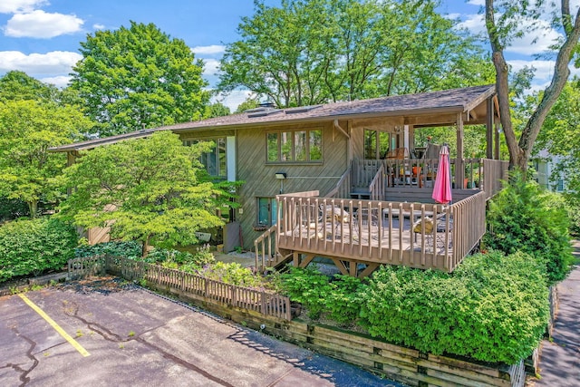 2109 W 5th Ave Unit C, Grandview Heights, OH 43212 - rear view of property with a wooden deck and uncovered parking