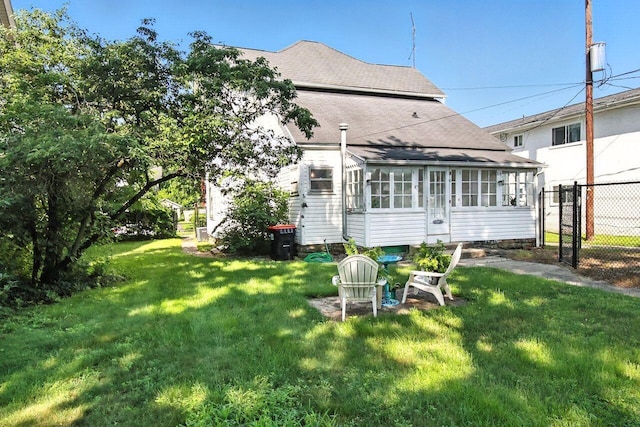 366 Hudson Ave, Newark, OH 43055 - back of house with a sunroom, roof with shingles, and a gate