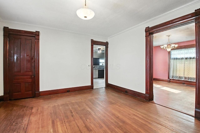 366 Hudson Ave, Newark, OH 43055 - unfurnished room featuring wood-type flooring, a chandelier, and crown molding