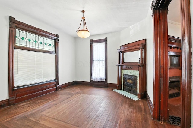 366 Hudson Ave, Newark, OH 43055 - unfurnished living room with a fireplace and dark wood-style flooring