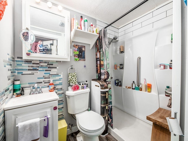 2640-2642 W Broad St, Columbus, OH 43204 - bathroom with vanity, a textured ceiling, and backsplash