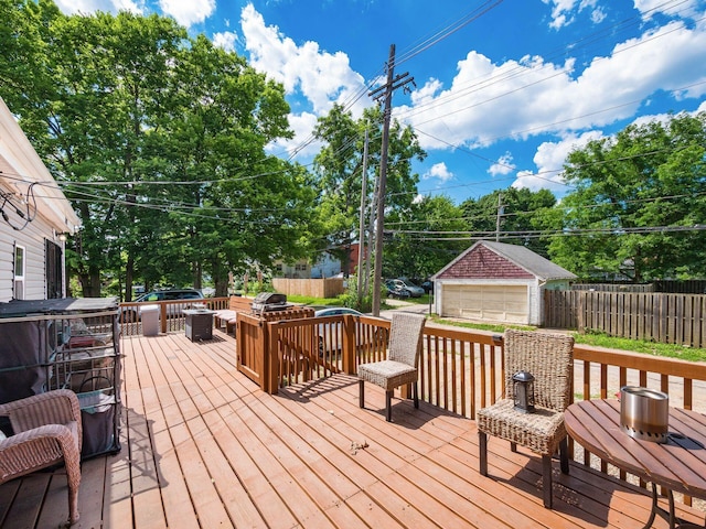 2640-2642 W Broad St, Columbus, OH 43204 - wooden deck featuring a garage and an outbuilding