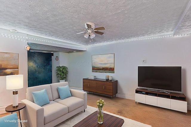 3162 New Year Dr, Cincinnati, OH 45251 - living area with ceiling fan, a textured ceiling, and concrete floors