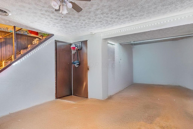3162 New Year Dr, Cincinnati, OH 45251 - below grade area featuring carpet, a ceiling fan, a textured ceiling, and stairs
