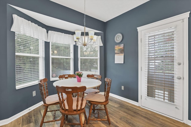6041 Tetlin Field Dr, New Albany, OH 43054 - dining area featuring a chandelier, wood finished floors, and healthy amount of natural light