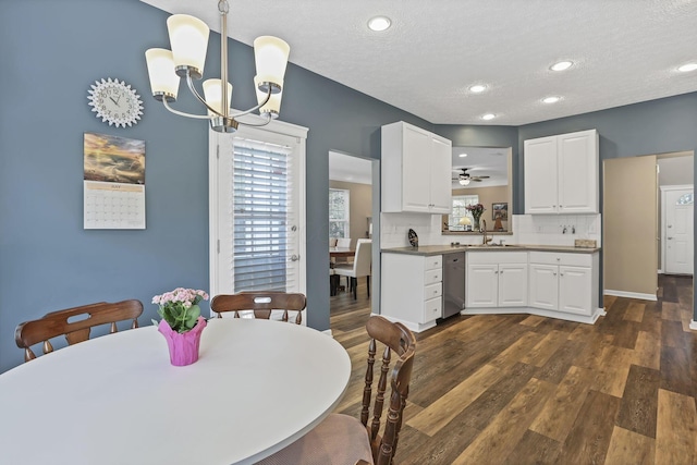 6041 Tetlin Field Dr, New Albany, OH 43054 - dining area with a chandelier, dark wood finished floors, a textured ceiling, and recessed lighting