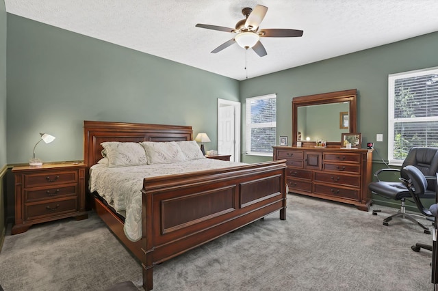 6041 Tetlin Field Dr, New Albany, OH 43054 - bedroom with light colored carpet, multiple windows, an office area, a textured ceiling, and ceiling fan