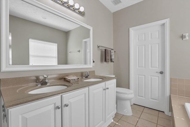 6041 Tetlin Field Dr, New Albany, OH 43054 - bathroom with double vanity, tile patterned flooring, and a tub