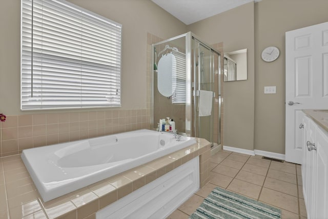 6041 Tetlin Field Dr, New Albany, OH 43054 - bathroom with a bath, a shower stall, tile patterned flooring, and vanity