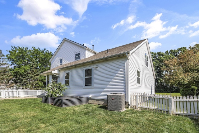 6041 Tetlin Field Dr, New Albany, OH 43054 - back of house featuring roof with shingles and a garden