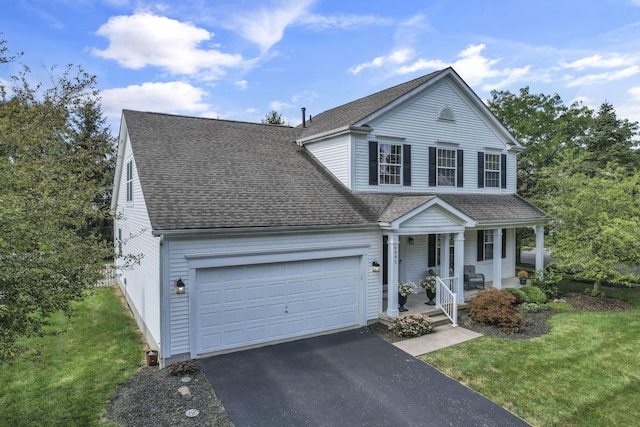 6041 Tetlin Field Dr, New Albany, OH 43054 - traditional home featuring covered porch, asphalt driveway, an attached garage, a shingled roof, and a front lawn