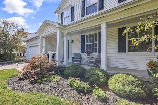 6041 Tetlin Field Dr, New Albany, OH 43054 - property entrance featuring covered porch, a garage, and concrete driveway