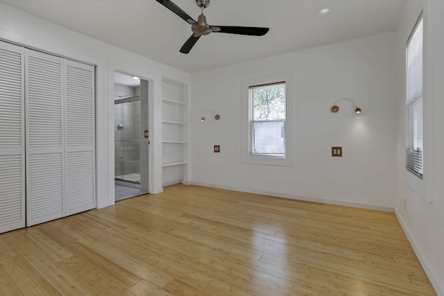 1808 Brentnell Ave, Columbus, OH 43219 - unfurnished bedroom with light wood-style flooring, connected bathroom, and a ceiling fan