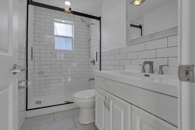 1808 Brentnell Ave, Columbus, OH 43219 - bathroom featuring a stall shower, vanity, tile walls, and marble look tiles