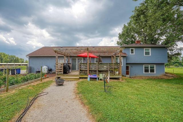 3910 Summit View Rd, Dublin, OH 43016 - back of house with a pergola, an outdoor fire pit, a deck, a chimney, and stucco siding