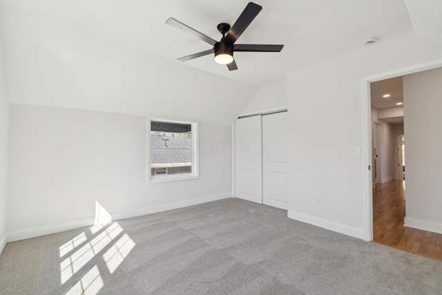 86 W N Broadway, Columbus, OH 43214 - unfurnished bedroom featuring vaulted ceiling, carpet, a closet, ceiling fan, and recessed lighting