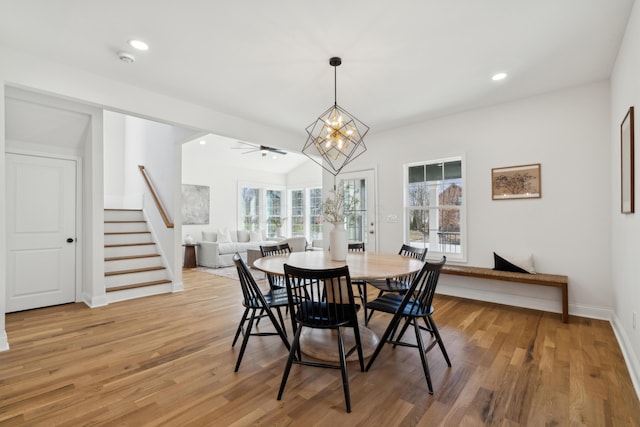 86 W N Broadway, Columbus, OH 43214 - dining area featuring stairway, light wood-type flooring, recessed lighting, and a chandelier