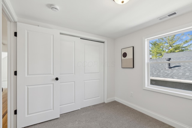 86 W N Broadway, Columbus, OH 43214 - unfurnished bedroom with light colored carpet and a closet