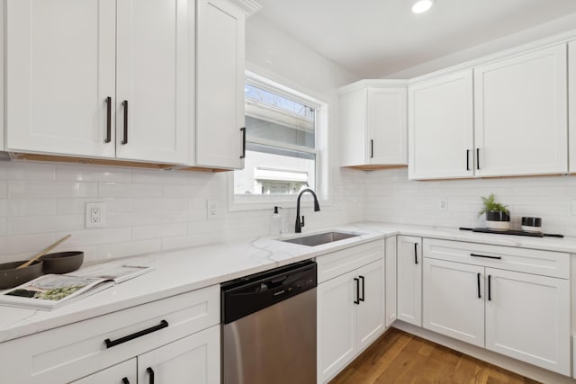 86 W N Broadway, Columbus, OH 43214 - kitchen with dishwasher, white cabinets, light wood finished floors, tasteful backsplash, and recessed lighting