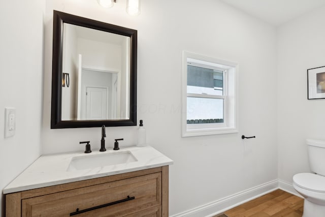 86 W N Broadway, Columbus, OH 43214 - half bathroom featuring vanity and wood finished floors
